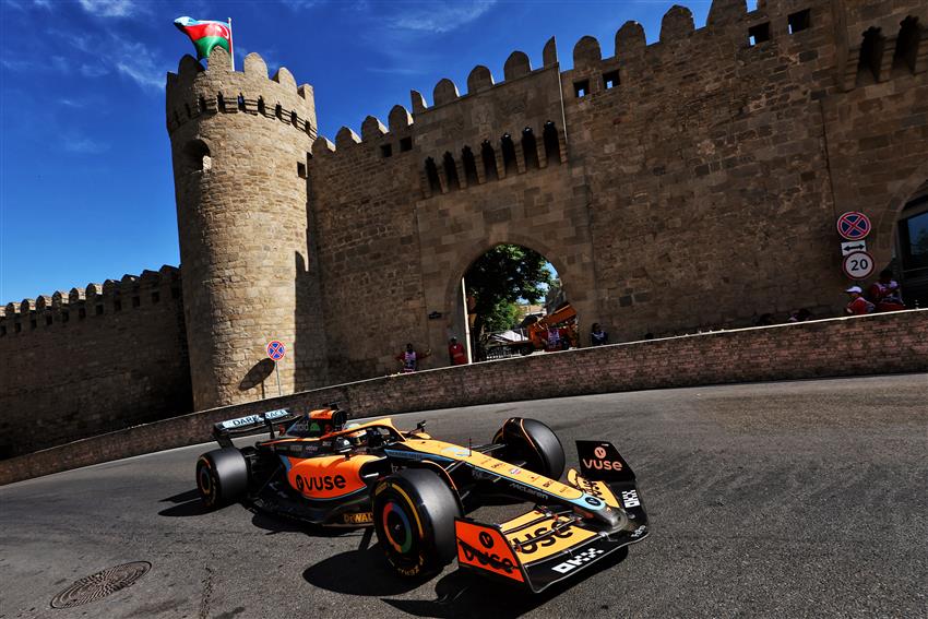 McLaren driving past castle